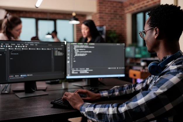 Blockchain developer reflecting at low levels of security and how to improve mainframe defence system. Pensive network engineer thinking of failed data processing operation.