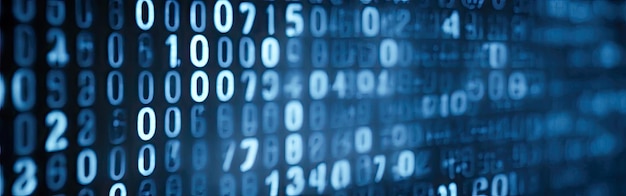 blue digital binary data on computer screen with bokeh abstract information technology background digital binary code matrix background closeup with small dept