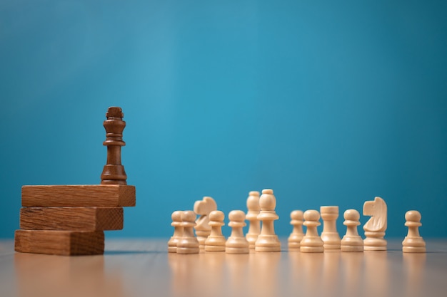 Brown king chess standing on a wooden stand. The concept of Leaders in good organizations must have a vision