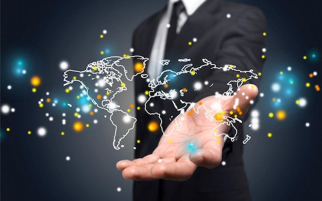 Business man hand holding icons with world map