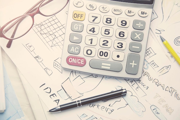 Business objects - graphs, charts, pen and calculator on the table