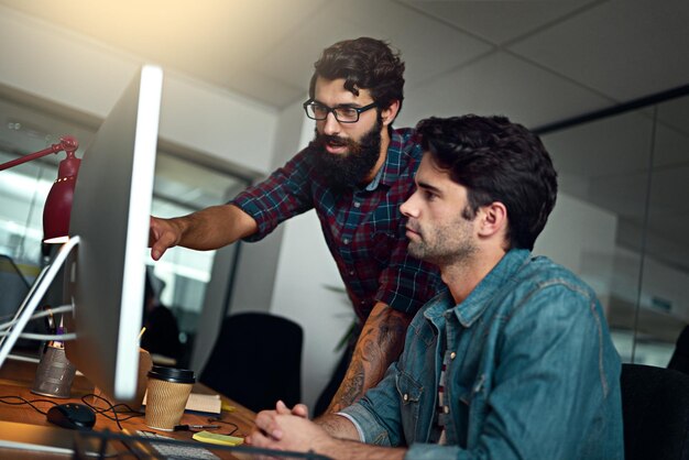 Business people computer and collaboration planning in creative agency for project information or research Male professionals and teamwork with pc for feedback communication and mentorship