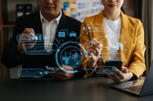 Business team working virtual modern smartphone to reduce CO2 emissions carbon footprint climate change to limit global warmingSustainable development and green business concept at office