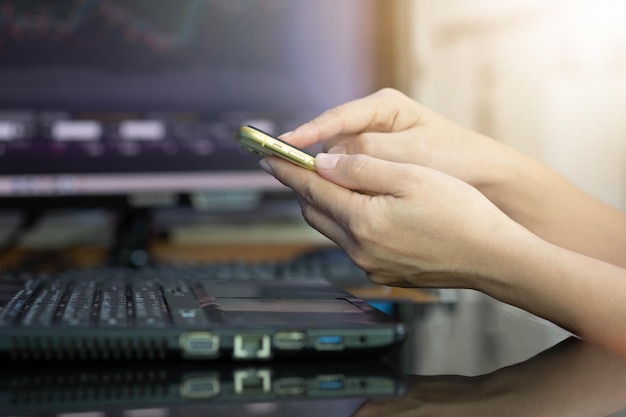 Business woman holding cellphone and successful performance action Successful investment concept