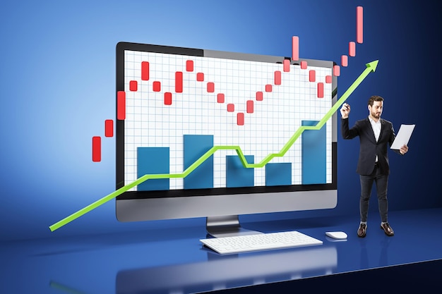 businessman analyzing growth chart on computer display in blue background