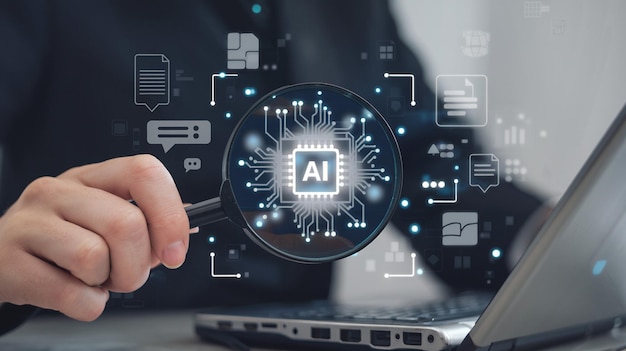 Businessman chatting with AI or artificial intelligence technology A man uses a laptop computer to