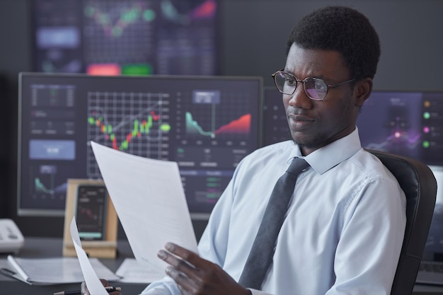 Businessman examining financial document