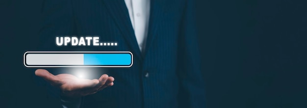 Businessman hand hold bar of Update Software Computer Program Upgrade Business Technology Internet Update on virtual screen Internet and technology concept loading bar with installing the update