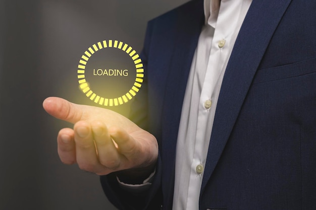 Businessman hand showing loading button on virtual screen Internet and technology concept