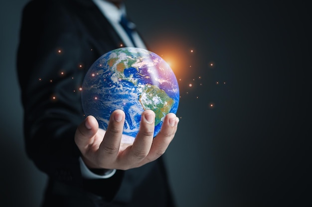 Businessman holding a model globe concept of network communication information network concept