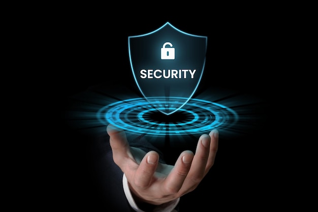 Businessman holding digital security icon in the hand internet security concept