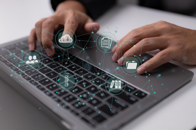Businessman is using a computer to think about document management, an online documentation database, digital file storage software, records keeping, database technology, file access, and docs.