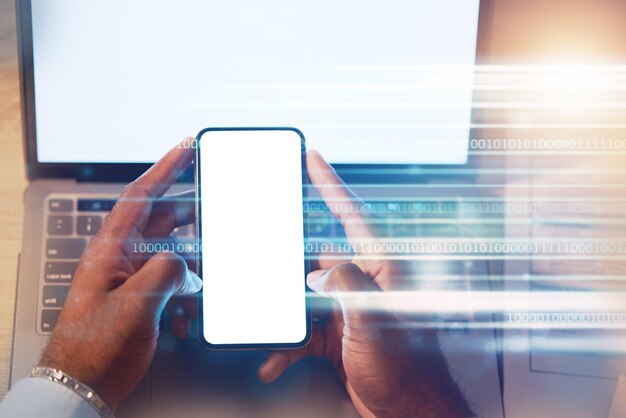 Businessman phone and hands on mockup screen at night for advertising or marketing above at office Hand of man working late on mobile smartphone app and laptop with copy space display on overlay