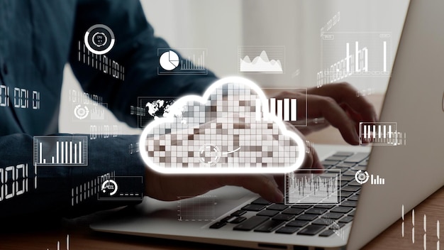 Businessman uses capable laptop computer to connect to cloud computing network