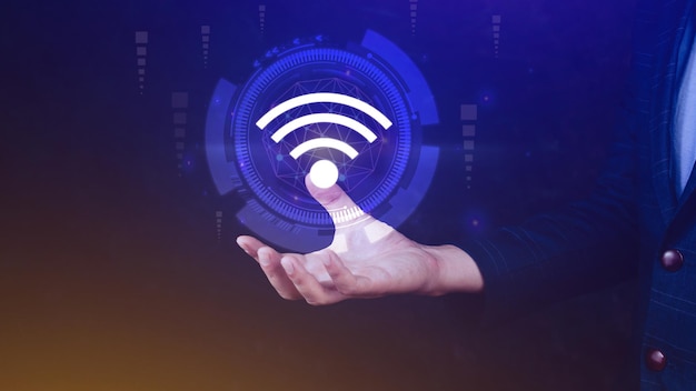 Businessman using holding with wifi icon Social network business communication concept Wifi wireless concept free network Internet concept