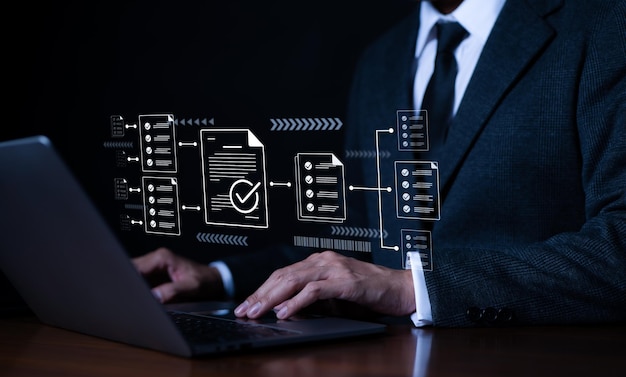 Businessman using laptop computer doing online checklist survey fill out digital form checklist Document management checking System online documentation database and process manage files Checkmark