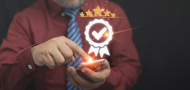 businessman using smartphone service evaluations with the sign of the top service quality assurance five 5 stars the customer satisfaction and service iso certification and standardization concept