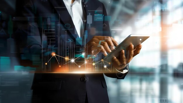 businessperson using a tablet with data and graphs overlayed representing modern technology and analysis
