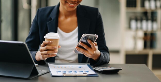 businesswoman hand using smart phone tablet payments and holding credit card online shopping omni channel digital tablet docking keyboard computer
