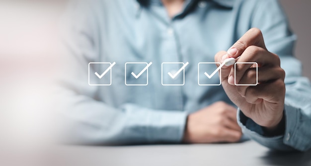 Checklist concept businessman taking online checklist survey filling out digital form checklist