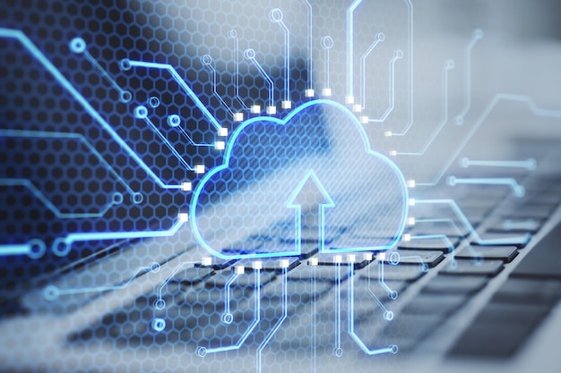 Close up laptop keyboard with abstract glowing cloud and chip interface on blurry background Cloud computing technology and database Double exposure