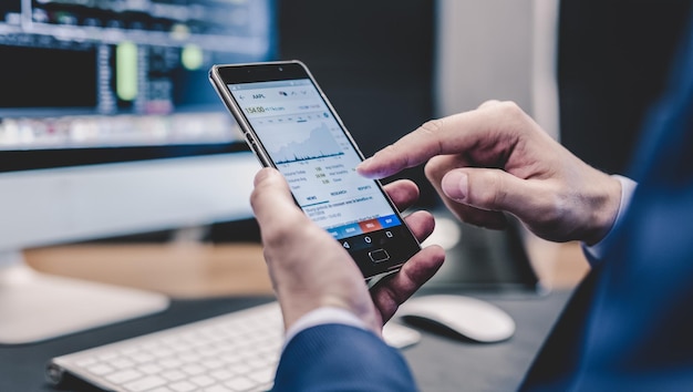 Close up of businessman using mobile smart phone