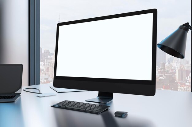 Close up of creative designer desktop with empty mock up computer monitor laptop and supplies in modern office with window and panoramic city view 3D Rendering
