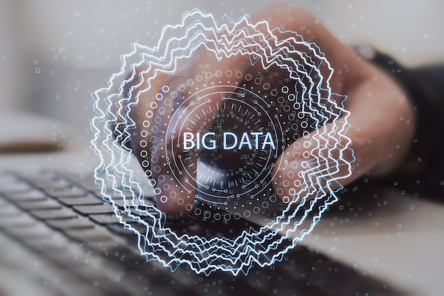 Close up of hand using notebook keyboard with abstract round big data hologram on blurry background Code and digital science concept Double exposure
