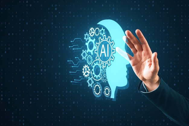 Close up of male hands using creative head outline and cogs ai hologram on dark blue tech background Artificial intelligence and machine learning concept