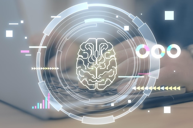 Close up of man hands using laptop keyboard on desk with glowing round brain hologram on blurry background Artificial intelligence chat GPT bot assistant and machine learning concept