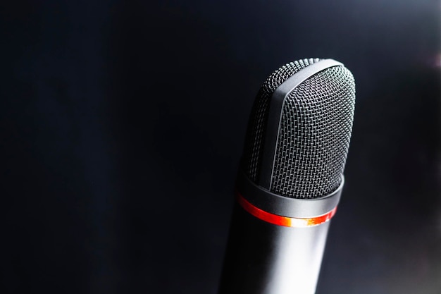 Close-up of microphone against gray background