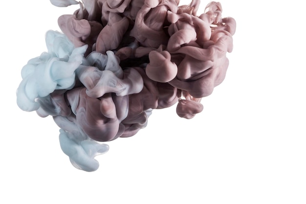 Close-up of paint dissolving against white background