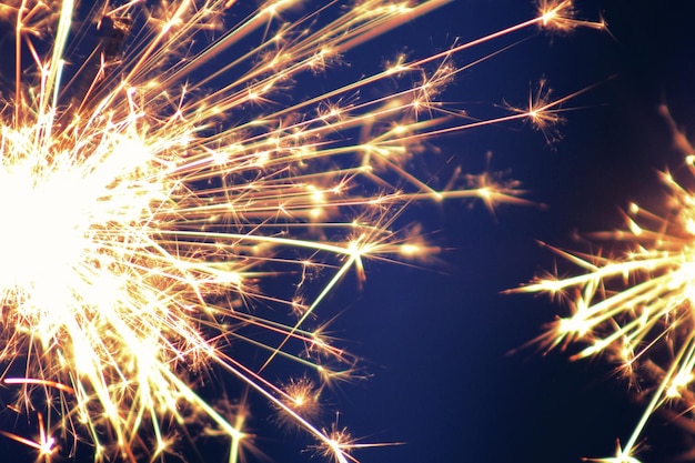 Close-up of sparklers at night