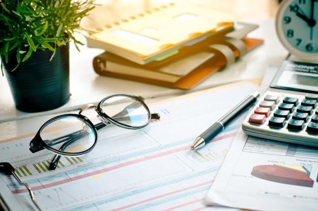 Close-up of various objects on desk in office