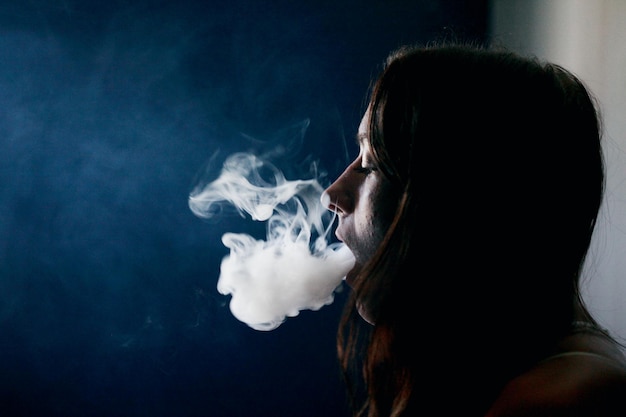 close-up of woman smoking cigarette