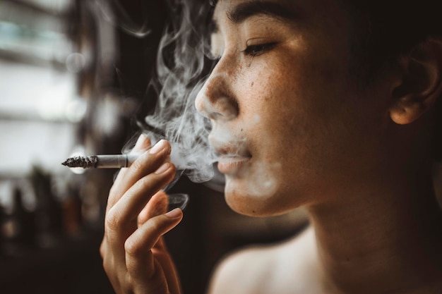 close-up of woman smoking cigarette