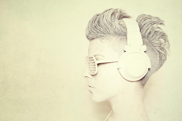 close-up of woman wearing novelty glasses and headphones