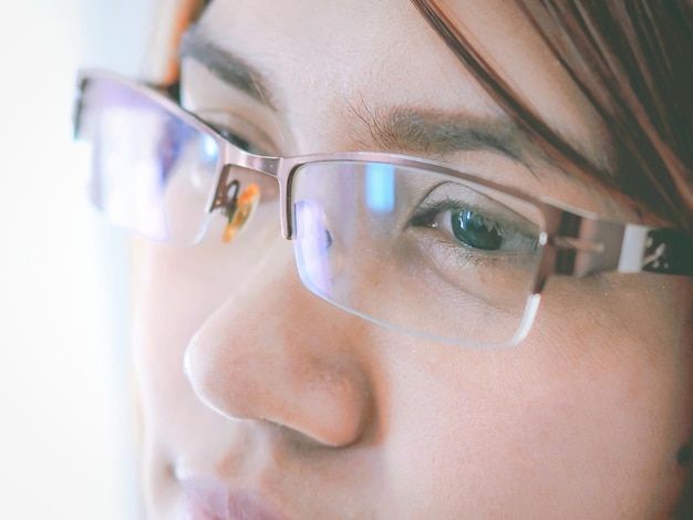 Close-up portrait of boy wearing eyeglasses