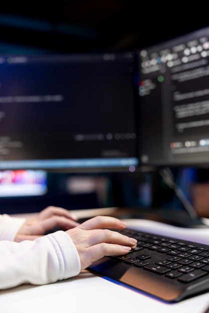 Close up shot of IT specialist writing testing and debugging code