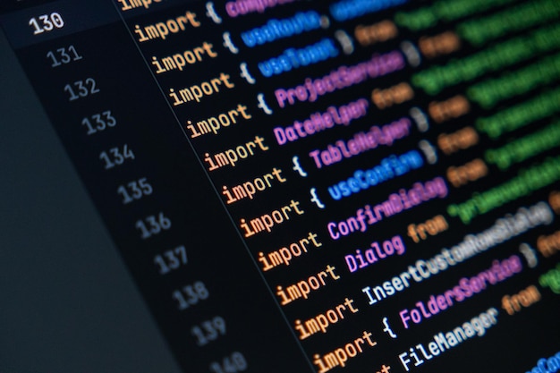 closeup of computer screen with colorful javascript code focus on import statement software development and programming