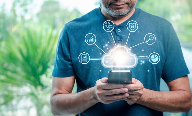 cloud technology data storage networking server and backup database on internet service concept businessman uses a smartphone with a cloud computing diagram display on a virtual screen copy space
