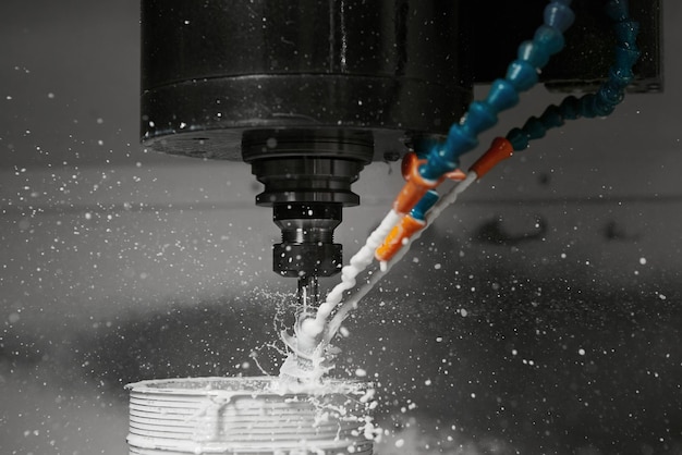 CNC milling machine cutting aluminium automotive part with coolant liquid Technology manufacturing