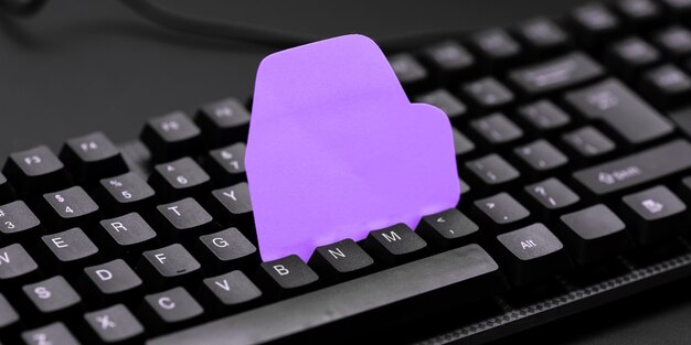 Colored sticker lying on black keyboard Important information written over paper Image with school supplies Multiple Assorted Collection Office Stationery