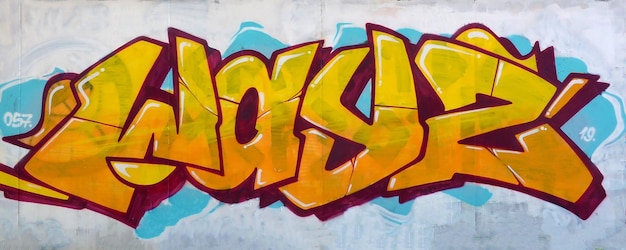 colorful background of graffiti painting artwork with bright aerosol outlines on wall old school street art piece made with aerosol spray paint cans contemporary youth culture
