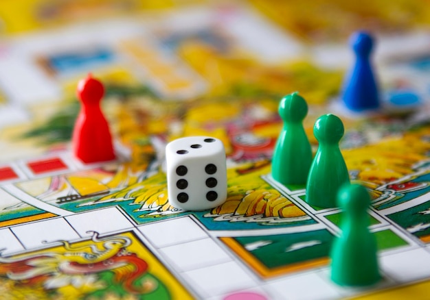 Colorful play figures with dice on board