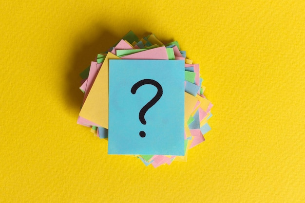 Colorful question marks written reminders tickets ask or business concept