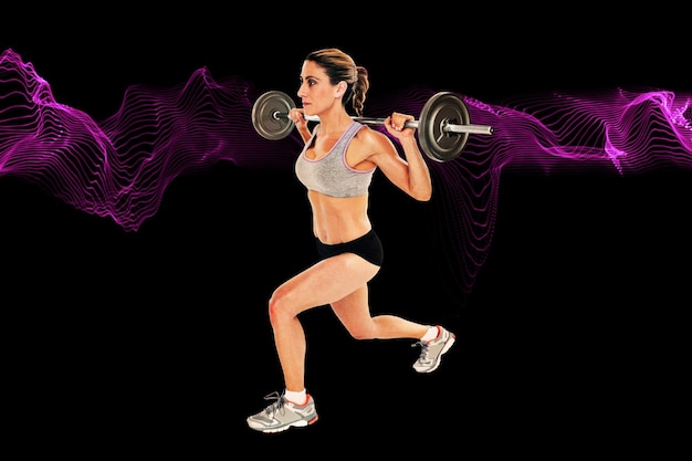 composite image of serious female crossfitter lifting barbell behind head