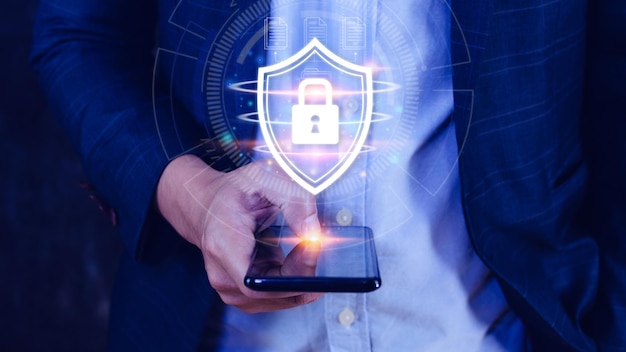 Computer network protection secure and safe your data concept businessman holding shield protection icon Security shield Lock Security Businessman Protect Concept