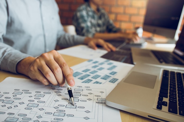 Computer programmers working at desk in office