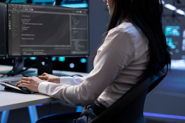 Computer scientist in data center using diagnostic tools on PC
